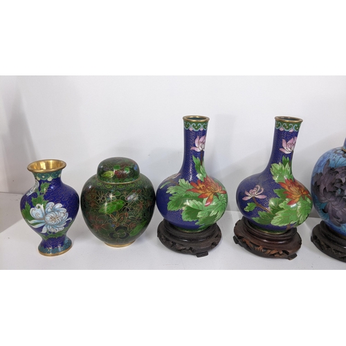 86 - A collection of vintage Chinese cloisonne vases and a ginger jar decorated with flowers and Ruyi flo... 