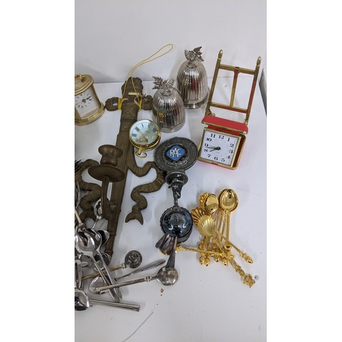 96 - A mixed lot to include loose cutlery, travel clock, eggcup with chick's head cover, and other items ... 