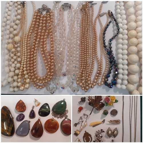 57 - A quantity of vintage costume jewellery to include 4 Aurora Borealis necklaces, simulated pearl neck... 