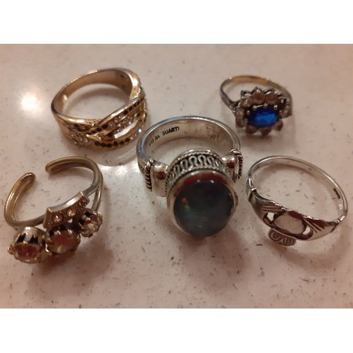 86 - A quantity of dress rings to include a silver gilt ring with blue and white stones, a silver ring wi... 