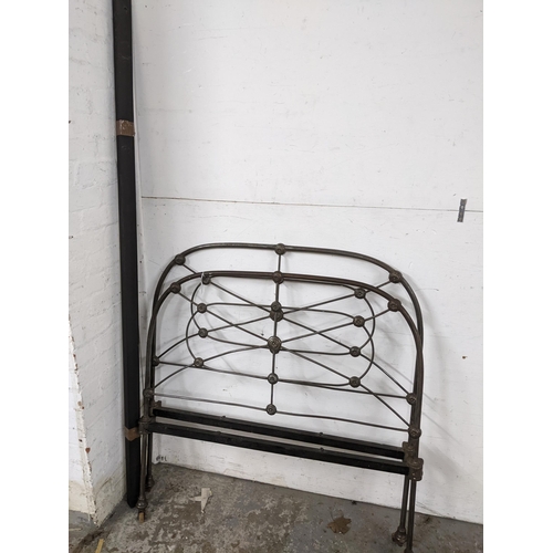 370 - Victorian cast iron head and foot boards, on castors, with two iron side slats Location:G