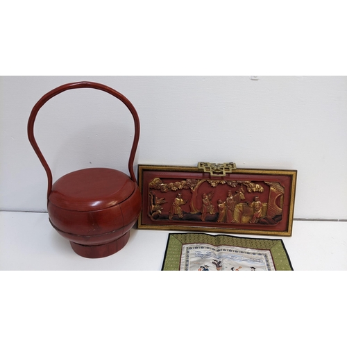 380 - Modern Chinese collectables to include a carved panel, a red lacquered wooden pot and cover and an e... 