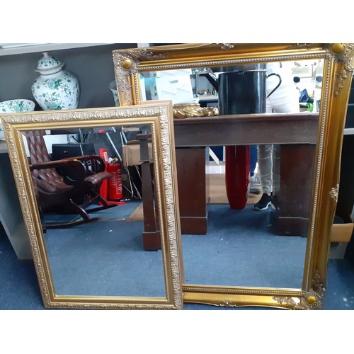 389 - Two modern large gold painted wall mirrors together with a 1920's frameless mirror. Location:RWB