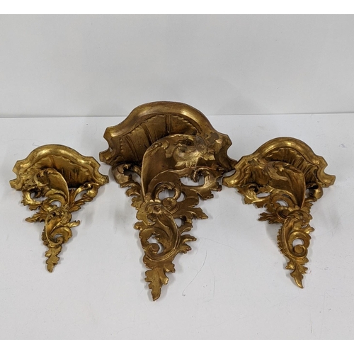 102 - Three mid 20th century gilt wood carved ornate wall brackets to include a pair and one larger, Locat... 