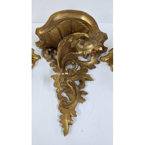 102 - Three mid 20th century gilt wood carved ornate wall brackets to include a pair and one larger, Locat... 