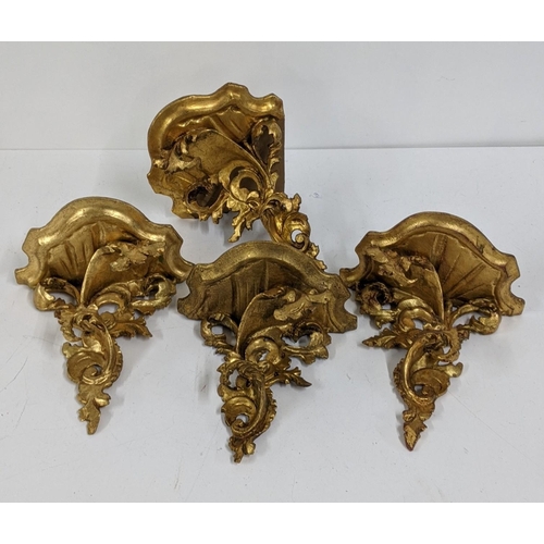 104 - Four mid 20th century gilt wood carved ornate wall brackets to include a corner wall bracket, Locati... 