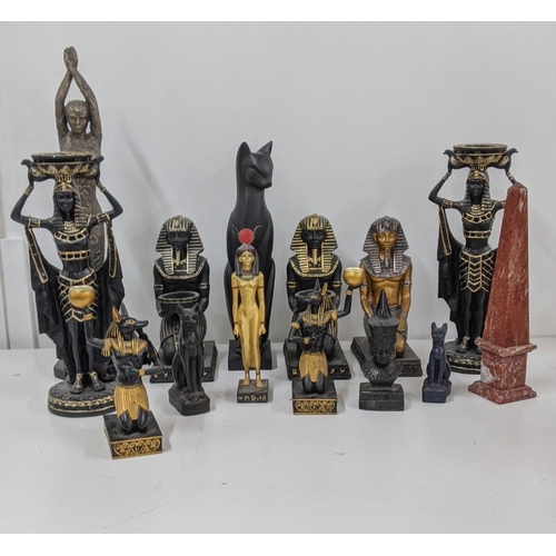 110 - A mixed group of classical Egyptian Gods and Goddess figurines, together with an Egyptian cat sculpt... 