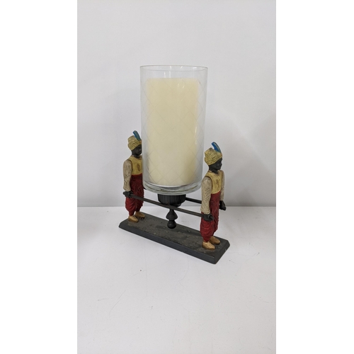 113 - A painted metal candle holder fashioned as two water boys, Location:A3M