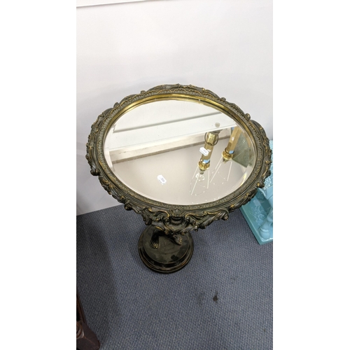 126 - A 20th century composition blackamoor mirror top occasional table, 69cm h, 45cm w, Location:RWB