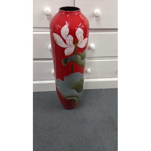 127 - A modern tall floor standing vase on a red ground, decorated with flowers, 20-30, Location:RAB