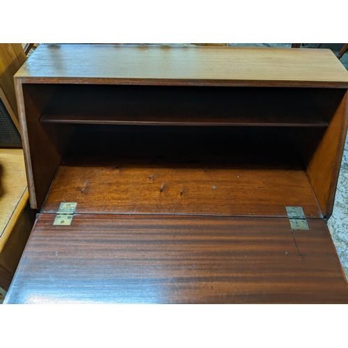 161 - An inlaid mahogany bureau, fall flap revealing a single shelf to interior, above a drawer, on square... 