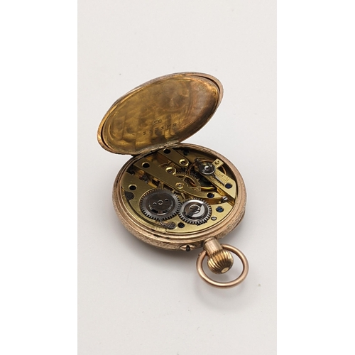 2 - An early 20th century gold keyless wound ladies fob watch having a white enamel dial with gilt highl... 