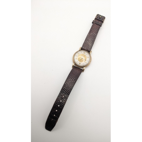 20 - A mid 20th century 9ct gold gents 15 jewel manual wind wristwatch on a brown leather strap A/F
Locat... 