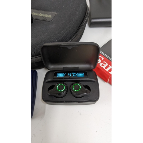 210 - A mixed lot to contain, DOSS bluetooth sound box, boxed True bluetooth earbuds, two pairs of earphon... 