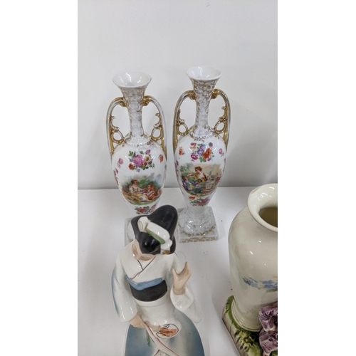 214 - Mixed ceramics to include a variety of figurines, a pair of twin handled ginger jars and paperweight... 