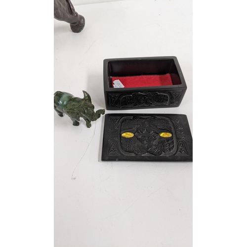 216 - A mixed lot to include a cast metal elephant, a trinket box, coasters and one other, Location:2.4