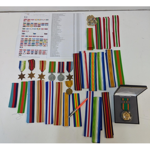 295 - War medal ribbons and a department of defence US plaque, a cased achievement medal embossed with an ... 