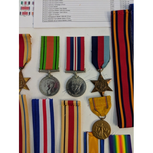 295 - War medal ribbons and a department of defence US plaque, a cased achievement medal embossed with an ... 