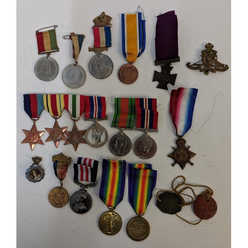 297 - Mixed WWI and WWII service medals, to include British war, Stars, a copy and dog tab 'Holdstock', Lo... 