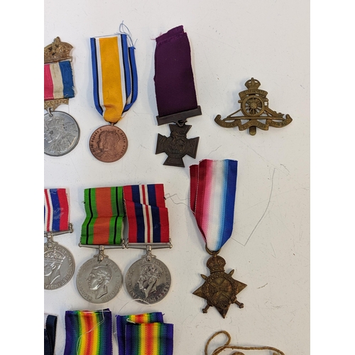 297 - Mixed WWI and WWII service medals, to include British war, Stars, a copy and dog tab 'Holdstock', Lo... 