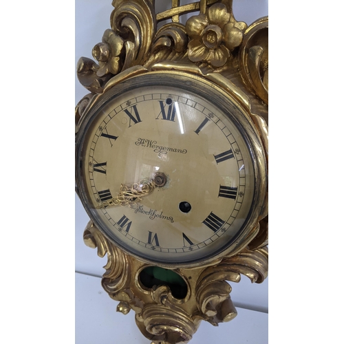 83 - A mid 20th century Swedish gilt carved 8 day wall clock, the dial signed Wergeman, 58.5h x 30W
Locat... 