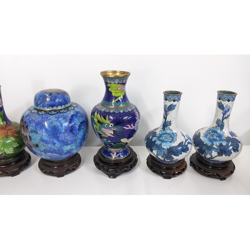 86 - A collection of vintage Chinese cloisonne vases and a ginger jar decorated with flowers and Ruyi flo... 