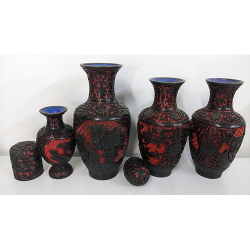 88 - A collection of Chinese cinnabar and enamel to include a three section trinket boxes, egg and fair v... 