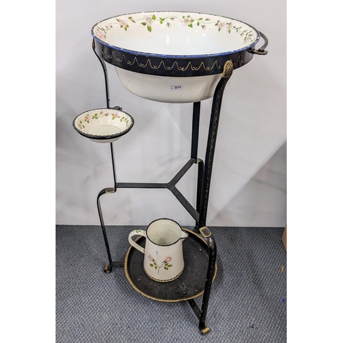 223 - An early 20th century cast iron wash stand having a painted wash bowl, soap dish and jug, together w... 