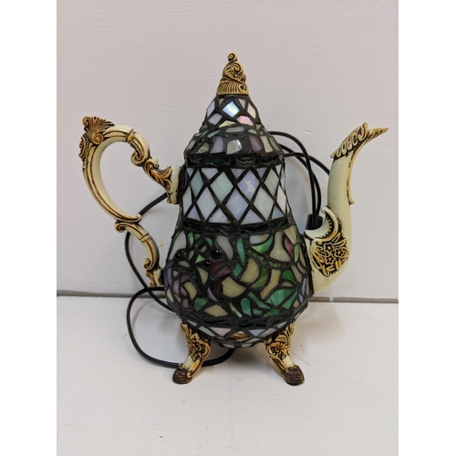 265 - Three Tiffany style lamps to include one fashioned as a teapot and a coffee pot (please not the plug... 