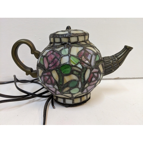 265 - Three Tiffany style lamps to include one fashioned as a teapot and a coffee pot (please not the plug... 