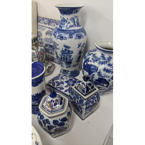 288 - A mixed lot of mostly blue and white ceramics to include two blue and white vases, blue and white li... 