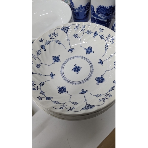 288 - A mixed lot of mostly blue and white ceramics to include two blue and white vases, blue and white li... 