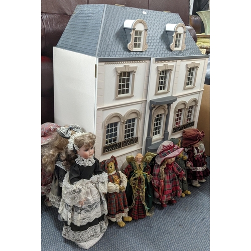 290 - A dolls house with mixed furniture, together with a collection of dolls, Location:A2F