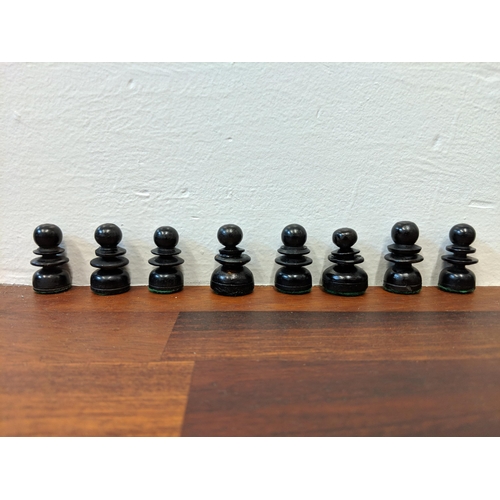 316 - A wooden chess set with pieces, LocationA4B