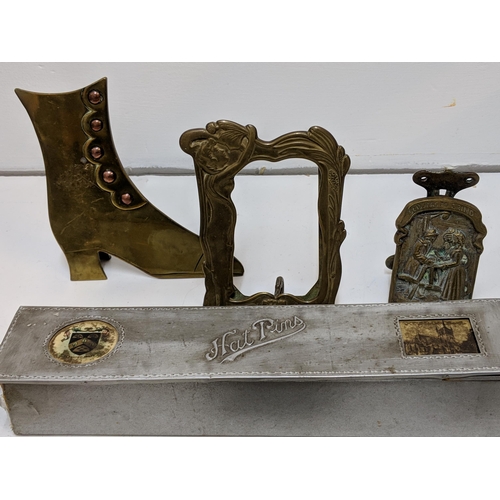 324 - Brass in include small door knockers and sundial, two framed 19th century boot plaques and a hat pin... 