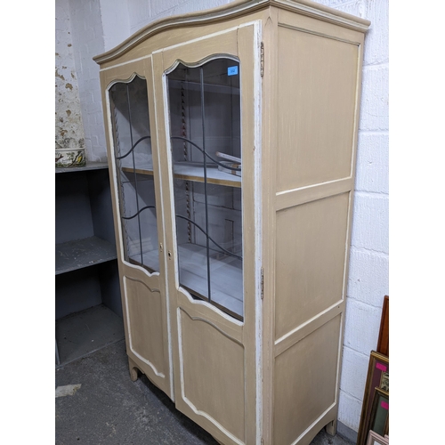 332 - A painted display cabinet with twin leaded display doors, three white painted adjustable shelves, on... 