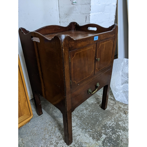 334 - A Georgian mahogany tray topped bedside commode, twin cupboard doors with inlaid stringing above a s... 