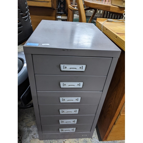 338 - A metal two drawer filing cabinet, 71 x 46 x 62 and a small six drawer metal filing cabinet, 64 x 34... 