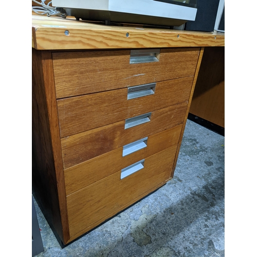 339 - A teak twin pedestal desk with later pine top, each pedestal with five graduated drawers, the loose ... 