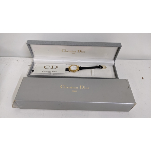 349 - A Christian Dior ladies gold plated quartz wristwatch, with guarantee and box, Location:T