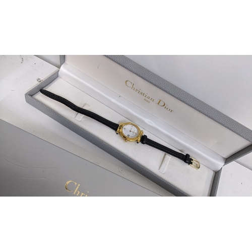 349 - A Christian Dior ladies gold plated quartz wristwatch, with guarantee and box, Location:T