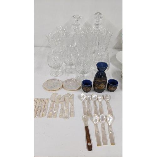 359 - A mixed lot to include crystal cut glassware to include two decanters, various drinking glasses alon... 