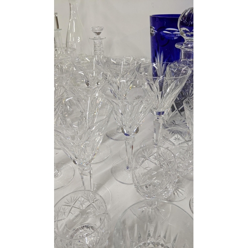 366 - A mixed lot of glassware to include Waterford, crystal cut bowls, a crystal cut cobalt blue vase, A/... 