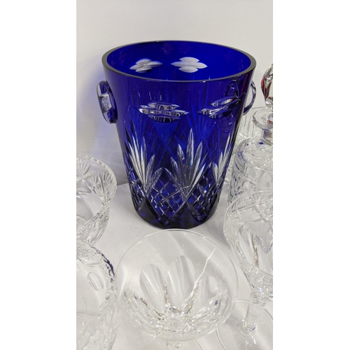 366 - A mixed lot of glassware to include Waterford, crystal cut bowls, a crystal cut cobalt blue vase, A/... 