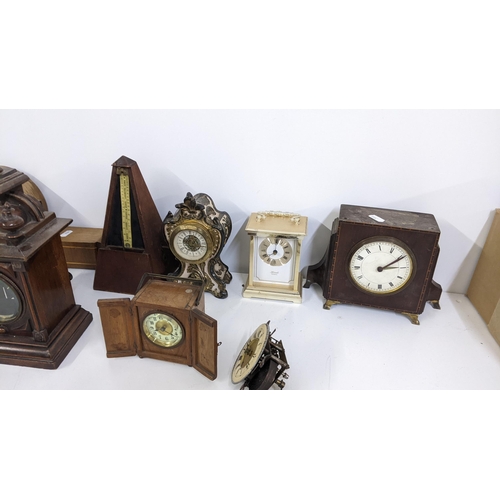 371 - Mixed clocks and a metronome to include a mid 20th century Timemaster mantle clock, Hermle carriage ... 