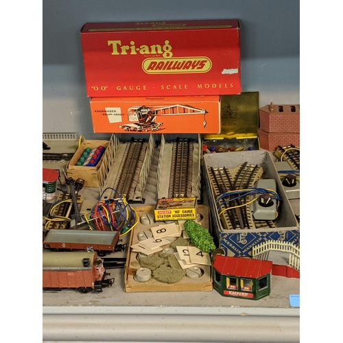 392 - A large quantity of mixed rolling stock and railway buildings and accessories to include, Tri-ang, M... 