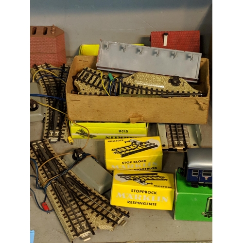 392 - A large quantity of mixed rolling stock and railway buildings and accessories to include, Tri-ang, M... 