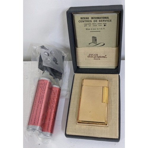 394 - A boxed DuPont gold plated lighter, together with original paperwork and lighter fluid, Location:T