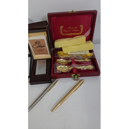 398 - Mixed pens and lighters to include a boxed Calibri lighter, together with boxed cutlery, gold plated... 