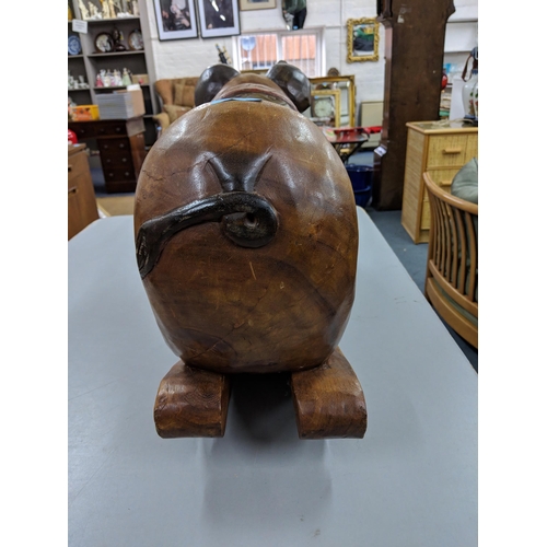 400 - A hardwood rocking seat fashioned as a pig, Location:RAB